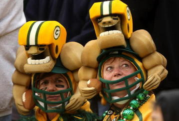 GREEN BAY, WI - OCTOBER 19:  Two Packers fans watch the game between the Indianapolis Colts and the Green Bay Packers on October 19, 2008 at Lambeau Field in Green Bay Wisconsin. The Packers won 34-14.   (Photo by Stephen Dunn/Getty Images)