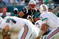 MIAMI - NOVEMBER 23:  Linebacker Mike Vrabel #50 of the New England Patriots looks in as quarterback Chad Pennington #10 of the Miami Dolphins prepares to take the snap at Dolphin Stadium on November 23, 2008 in Miami, Florida. The Patriots defeated the Dolphins 48-28.  (Photo by Doug Benc/Getty Images)