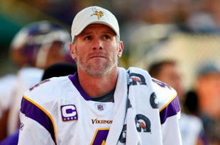 GREEN BAY, WI - NOVEMBER 01: Quarterback Brett Favre #4 of the Minnesota Vikings walks on the sidelines during the first quarter of the game against the Green Bay Packers at Lambeau Field on November 1, 2009 in Green Bay, Wisconsin. (Photo by Scott Boehm/Getty Images)