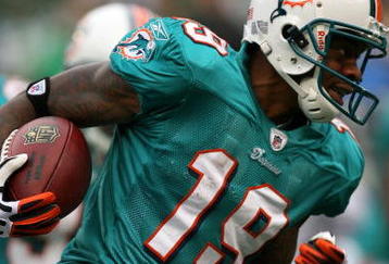 EAST RUTHERFORD, NJ - NOVEMBER 01:  Ted Ginn #19 of the Miami Dolphins returns a kick off during a game against the New York Jets at Giants Stadium on November 1, 2009 in East Rutherford, New Jersey.  (Photo by Chris Trotman/Getty Images)