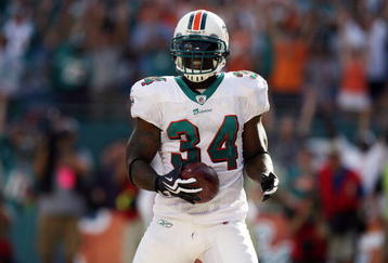 MIAMI - OCTOBER 25:  Running back Ricky Williams #34 of the Miami Dolphins celebrates a touchdown run against the New Orleans Saints at Land Shark Stadium on October 25, 2009 in Miami, Florida.  (Photo by Doug Benc/Getty Images)