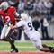 COLUMBUS, OH - OCTOBER 25: Quarterback Terrell Pryor #2 of the Ohio State Buckeyes fumbles the ball after being hit by defensive back Mark Rubin #9 of the Penn State Nittany Lions on October 25, 2008 at Ohio Stadium in Columbus, Ohio. Penn State recovered the ball and went on to score the game-winning touchdown. Penn State recovered the ball and went on to score the game-winning touchdown in their 13-6 victory over Ohio State. (Photo by Jamie Sabau/Getty Images)