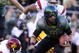 EUGENE, OR - OCTOBER 31: Quarterback Jeremiah Masoli #8 of the Oregon Ducks breaks a tackle of linebacker Malcolm Smith #6 as he heads to the end zone in the first quarter of the game against the USC Trojans at Autzen Stadium on October 31, 2009 in Eugene, Oregon. Masoli threw for 222 yards and a touchdown and ran for 164 more yards with another score as Oregon defeated USC 47-20. (Photo by Steve Dykes/Getty Images)