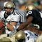 SOUTH BEND, IN - NOVEMBER 12:  Marco Nelson #29 of the Navy Midshipman runs for yardage as teammate Reggie Campbell #7 blocks Maurice Crum #40 of the Notre Dame Fighting Irish on November 12, 2005 at Notre Dame Stadium in South Bend, Indiana. Notre Dame defeated Navy 42-21.  (Photo by Jonathan Daniel/Getty Images)