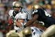 SOUTH BEND, IN - NOVEMBER 12:  Marco Nelson #29 of the Navy Midshipman runs for yardage as teammate Reggie Campbell #7 blocks Maurice Crum #40 of the Notre Dame Fighting Irish on November 12, 2005 at Notre Dame Stadium in South Bend, Indiana. Notre Dame defeated Navy 42-21.  (Photo by Jonathan Daniel/Getty Images)