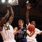 NEW YORK - NOVEMBER 21: Jon Scheyer #30 of the Duke Blue Devils goes to the basket between DeShawn Sims #34 and Manny Harris #3 of the Michigan Wolverines on November 21, 2008 at Madison Square Garden in New York City. (Photo by Nick Laham/Getty Images)
