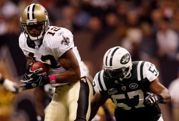 NEW ORLEANS - OCTOBER 04:  Marques Colston #12 of the New Orleans Saints makes a catch over Bart Scott #57 of the New York Jets at the Louisana Superdome on October 4, 2009 in New Orleans, Louisiana.  (Photo by Chris Graythen/Getty Images)