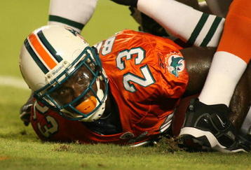 MIAMI - OCTOBER 12:  Running back Ronnie Brown #23 of the Miami Dolphins scores a touchdown against the New York Jets fans prior to their game at Land Shark Stadium on October 12, 2009 in Miami, Florida. Miami defeated New York 31-27.  (Photo by Marc Serota/Getty Images)