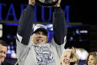 NEW YORK - NOVEMBER 4:  Manager Joe Girardi of the New York Yankees celebrates with the trophy after their 7-3 win against the Philadelphia Phillies in Game Six of the 2009 MLB World Series at Yankee Stadium on November 4, 2009 in the Bronx borough of New York City.  (Photo by David J. Phillip-Pool/Getty Images)