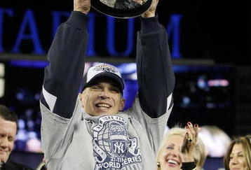 NEW YORK - NOVEMBER 4:  Manager Joe Girardi of the New York Yankees celebrates with the trophy after their 7-3 win against the Philadelphia Phillies in Game Six of the 2009 MLB World Series at Yankee Stadium on November 4, 2009 in the Bronx borough of New York City.  (Photo by David J. Phillip-Pool/Getty Images)