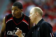 LAS VEGAS - NOVEMBER 29:  Dion Dixon #3 of Cincinnati talks to head coach Mick Cronin during a game against UNLV during the Global Sports Classic tournament at the Thomas & Mack Center November 29, 2008 in Las Vegas, Nevada. Cincinnati won 67-65.  (Photo by Ethan Miller/Getty Images)