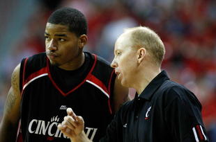 LAS VEGAS - NOVEMBER 29:  Dion Dixon #3 of Cincinnati talks to head coach Mick Cronin during a game against UNLV during the Global Sports Classic tournament at the Thomas & Mack Center November 29, 2008 in Las Vegas, Nevada. Cincinnati won 67-65.  (Photo by Ethan Miller/Getty Images)