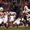 SAN DIEGO, CA - DECEMBER 30:   Runningback LeGarrette Blount #9 of the University of Oregon Ducks hurdles a player en route to a touchdown during his team's 42-31 win over the Oklahoma State University Cowboys in the Pacific Life Holiday Bowl at Qualcomm Stadium on December 30, 2008 in San Diego, California. (Photo by Donald Miralle/Getty Images)