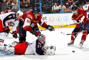 ATLANTA - NOVEMBER 05:  Goaltender Mathieu Garon #32 of the Columbus Blue Jackets saves a shot on goal in front of Nik Antropov #80 and Rich Peverley #47 of the Atlanta Thrashers at Philips Arena on November 5, 2009 in Atlanta, Georgia.  (Photo by Kevin C. Cox/Getty Images)