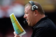 KANSAS CITY, MO - SEPTEMBER 20:  Head coach Tom Cable of the Oakland Raiders calls plays from the bench during the game against the Kansas City Chiefs at Arrowhead Stadium on September 20, 2009 in Kansas City, Missouri.  (Photo by Jamie Squire/Getty Images)