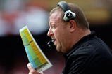 KANSAS CITY, MO - SEPTEMBER 20:  Head coach Tom Cable of the Oakland Raiders calls plays from the bench during the game against the Kansas City Chiefs at Arrowhead Stadium on September 20, 2009 in Kansas City, Missouri.  (Photo by Jamie Squire/Getty Images)