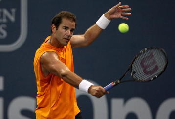LOS ANGELES, CA - JULY 27:  Tournament honoree Pete Sampras returns a shot to Marat Safin of Russia in the Millennium Challenge during the LA Tennis Open Day 1 at Los Angeles Tennis Center - UCLA on July 27, 2009 in Los Angeles, California.  (Photo by Stephen Dunn/Getty Images)