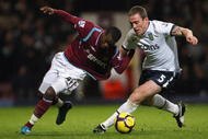 LONDON, ENGLAND - NOVEMBER 04:  Zavon Hines (L) of West Ham contests with Richard Dunne of Aston Villa during the Barclays Premier League match between West Ham United and Aston Villa at Upton Park on November 4, 2009 in London, England.  (Photo by Hamish Blair/Getty Images)