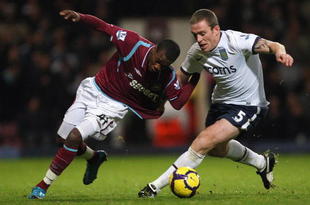 LONDON, ENGLAND - NOVEMBER 04: Zavon Hines (L) of West Ham contests with Richard Dunne of Aston Villa during the Barclays Premier League match between West Ham United and Aston Villa at Upton Park on November 4, 2009 in London, England. (Photo by Hamish Blair/Getty Images)