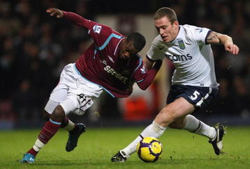LONDON, ENGLAND - NOVEMBER 04:  Zavon Hines (L) of West Ham contests with Richard Dunne of Aston Villa during the Barclays Premier League match between West Ham United and Aston Villa at Upton Park on November 4, 2009 in London, England.  (Photo by Hamish Blair/Getty Images)
