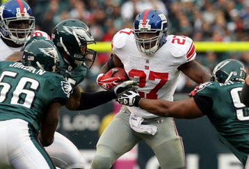 PHILADELPHIA - NOVEMBER 01:  Brandon Jacobs #27 of the New York Giants is stopped on a run by the defense of the Philadelphia Eagles on November 1, 2009 at Lincoln Financial Field in Philadelphia, Pennsylvania. The Eagles defeated the Giants 40-17.  (Photo by Jim McIsaac/Getty Images)