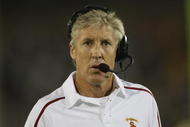 LOS ANGELES, CA - OCTOBER 24: Head coach Pete Carroll of the USC Trojans talks on his headset against the Oregon State Beavers on October 24, 2009 at the Los Angeles Coliseum in Los Angeles, California. USC won 42-36. (Photo by Jeff Golden/Getty Images)