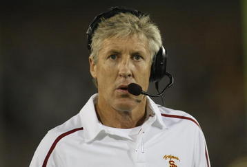 LOS ANGELES, CA - OCTOBER 24:  Head coach Pete Carroll of the USC Trojans talks on his headset against the Oregon State Beavers on October 24, 2009 at the Los Angeles Coliseum in Los Angeles, California.  USC won 42-36.  (Photo by Jeff Golden/Getty Images)