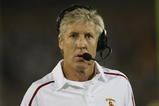 LOS ANGELES, CA - OCTOBER 24:  Head coach Pete Carroll of the USC Trojans talks on his headset against the Oregon State Beavers on October 24, 2009 at the Los Angeles Coliseum in Los Angeles, California.  USC won 42-36.  (Photo by Jeff Golden/Getty Images)