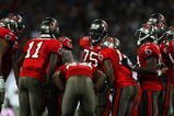 LONDON, ENGLAND - OCTOBER 25: The Tampa Bay Buccaneers offense in discussion during the NFL International Series match between New England Patriots and Tampa Bay Buccaneers at Wembley Stadium on October 25, 2009 in London, England. This is the third occasion where a regular season NFL match has been played in London.  (Photo by Julian Finney/Getty Images)