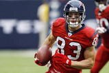HOUSTON - SEPTEMBER 27:  Wide receiver Kevin Walter #83 of the Houston Texans runs with the ball after a reception against the Jacksonville Jaguars at Reliant Stadium on September 27, 2009 in Houston, Texas.  (Photo by Bob Levey/Getty Images)