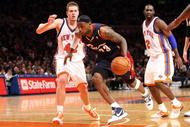 NEW YORK - FEBRUARY 04:  LeBron James #23 of the Cleveland Cavaliers drives to the basket past David Lee #42 of the New York Knicks on February 4, 2009 at Madison Square Garden in New York City. NOTE TO USER: User expressly acknowledges and agrees that, by downloading and or using this photograph, User is consenting to the terms and conditions of the Getty Images License Agreement.  (Photo by Nick Laham/Getty Images)