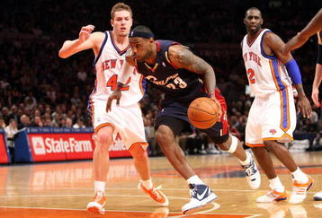 NEW YORK - FEBRUARY 04:  LeBron James #23 of the Cleveland Cavaliers drives to the basket past David Lee #42 of the New York Knicks on February 4, 2009 at Madison Square Garden in New York City. NOTE TO USER: User expressly acknowledges and agrees that, by downloading and or using this photograph, User is consenting to the terms and conditions of the Getty Images License Agreement.  (Photo by Nick Laham/Getty Images)