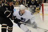 DALLAS - OCTOBER 28:  Jason Blake #55 of the Toronto Maple Leafs skates the puck against Nicklas Grossman #2 of the Dallas Stars at American Airlines Center on October 28, 2009 in Dallas, Texas.  (Photo by Ronald Martinez/Getty Images)