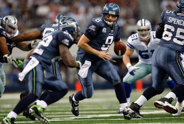 ARLINGTON, TX - NOVEMBER 01:  Quarterback Matt Hasselbeck #8 of the Seattle Seahawks drops back to pass against the Dallas Cowboys at Cowboys Stadium on November 1, 2009 in Arlington, Texas.  (Photo by Ronald Martinez/Getty Images)