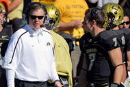 BOULDER, CO - OCTOBER 31: Head coach Dan Hawkins of the Colorado Buffaloes leads his team against the Missouri Tigers with his son Cody Hawkins #7 on the sidelines at Folsom Field on October 31, 2009 in Boulder, Colorado. Missouri defeated Colorado 36-17. (Photo by Doug Pensinger/Getty Images)