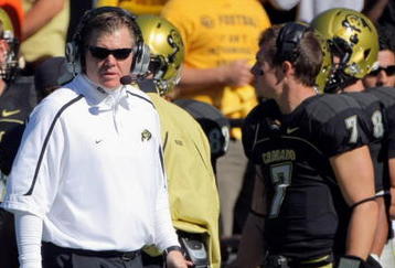 BOULDER, CO - OCTOBER 31:  Head coach Dan Hawkins of the Colorado Buffaloes leads his team against the Missouri Tigers with his son Cody Hawkins #7 on the sidelines at Folsom Field on October 31, 2009 in Boulder, Colorado. Missouri defeated Colorado 36-17.  (Photo by Doug Pensinger/Getty Images)