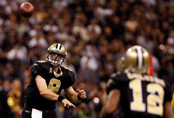 NEW ORLEANS - NOVEMBER 02:  Quarterback Drew Brees #9 of the New Orleans Saints throws a pass to Marques Colston #12 of the New Orleans Saints during the game against the Atlanta Falcons at Louisana Superdome on November 2, 2009 in New Orleans, Louisiana.  (Photo by Chris Graythen/Getty Images)