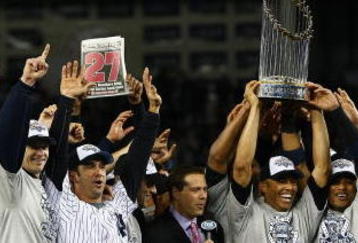 NEW YORK - NOVEMBER 04:  (L-R) A.J. Burnett #34, Jorge Posada #20, Derek Jeter #2, Mariano Rivera #42 (holding trophy) Robinson Cano #24 and Nick Swisher #33 of the New York Yankees against the Philadelphia Phillies in Game Six of the 2009 MLB World Series at Yankee Stadium on November 4, 2009 in the Bronx borough of New York City.  (Photo by Chris McGrath/Getty Images)