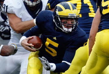 ANN ARBOR, MI - OCTOBER 24:  Tate Forcier #5 of the Michigan Wolverines carries the ball during the game against the Penn State Nittany Lions on October 24, 2009 at Michigan Stadium in Ann Arbor, Michigan. (Photo by  Gregory Shamus/Getty Images)