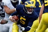 ANN ARBOR, MI - OCTOBER 24:  Tate Forcier #5 of the Michigan Wolverines carries the ball during the game against the Penn State Nittany Lions on October 24, 2009 at Michigan Stadium in Ann Arbor, Michigan. (Photo by  Gregory Shamus/Getty Images)
