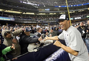 NEW YORK - NOVEMBER 04:  Mariano Rivera #42 of the New York Yankees celebrates with the fans after their 7-3 win against the Philadelphia Phillies in Game Six of the 2009 MLB World Series at Yankee Stadium on November 4, 2009 in the Bronx borough of New York City.  (Photo by Nick Laham/Getty Images)