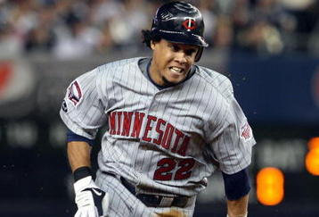 NEW YORK - OCTOBER 09:  Carlos Gomez #22 of the Minnesota Twins runs against the New York Yankees in Game Two of the ALDS during the 2009 MLB Playoffs at Yankee Stadium on October 9, 2009 in the Bronx borough of New York City.  (Photo by Jim McIsaac/Getty Images)
