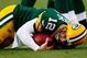 GREEN BAY, WI - NOVEMBER 01:  Quarterback Aaron Rodgers #12 of the Green Bay Packers is sacked during the third quarter of the game against the Minnesota Vikings at Lambeau Field on November 1, 2009 in Green Bay, Wisconsin. (Photo by Scott Boehm/Getty Images)