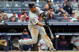 NEW YORK - MAY 17:  Carlos Gomez #22 of the Minnesota Twins connects for a eigth inning base hit against the New York Yankees on May 17, 2009 at Yankee Stadium in the Bronx borough of New York City.  (Photo by Jim McIsaac/Getty Images)