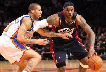 NEW YORK - FEBRUARY 04:  LeBron James #23 of the Cleveland Cavaliers drives the ball to the basket against Wilson Chandler #21 of the New York Knicks on February 4, 2009 at Madison Square Garden in New York City. NOTE TO USER: User expressly acknowledges and agrees that, by downloading and or using this photograph, User is consenting to the terms and conditions of the Getty Images License Agreement.  (Photo by Nick Laham/Getty Images)