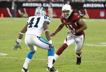 GLENDALE, AZ - NOVEMBER 01:  Wide receiver Larry Fitzgerald #11 of the Arizona Cardinals runs from the line of scrimage during the NFL game against the Carolina Panthers at the Universtity of Phoenix Stadium on November 1, 2009 in Glendale, Arizona. The Panthers defeated the Cardinals 34-21.  (Photo by Christian Petersen/Getty Images)