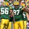 GREEN BAY, WI - OCTOBER 18: Johnny Jolly #97 and  Nick Barnett #56 of the Green Bay Packers celebrate a defensive stop against the Detroit Lions at Lambeau Field on October 18, 2009 in Green Bay, Wisconsin. The Packers defeated the Lions 26-0. (Photo by Jonathan Daniel/Getty Images)