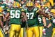 GREEN BAY, WI - OCTOBER 18: Johnny Jolly #97 and  Nick Barnett #56 of the Green Bay Packers celebrate a defensive stop against the Detroit Lions at Lambeau Field on October 18, 2009 in Green Bay, Wisconsin. The Packers defeated the Lions 26-0. (Photo by Jonathan Daniel/Getty Images)