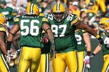 GREEN BAY, WI - OCTOBER 18: Johnny Jolly #97 and  Nick Barnett #56 of the Green Bay Packers celebrate a defensive stop against the Detroit Lions at Lambeau Field on October 18, 2009 in Green Bay, Wisconsin. The Packers defeated the Lions 26-0. (Photo by Jonathan Daniel/Getty Images)