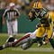 GREEN BAY, WI - SEPTEMBER 13: Greg Jennings #85 of the Green Bay Packers breaks away from Al Afalava #24 of the Chicago Bears on September 13, 2009 at Lambeau Field in Green Bay, Wisconsin. (Photo by Jonathan Daniel/Getty Images)